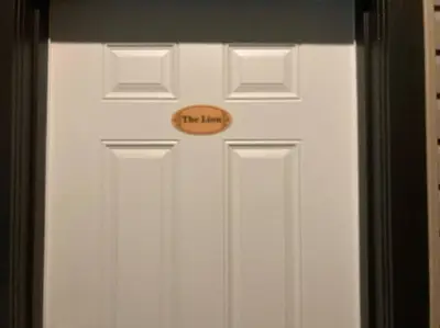 a white door with a sign on it at The Lions Self Contained Suite, Shared Pool, Hot Tub, Views in North Vancouver