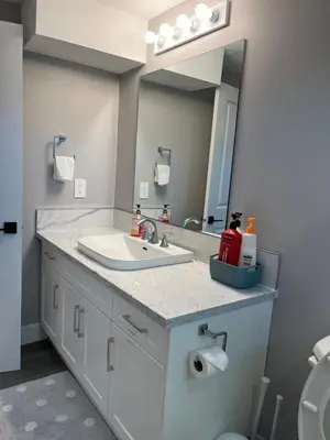 a bathroom with a sink and a mirror at Dugg Bed And Breakfast in Victoria