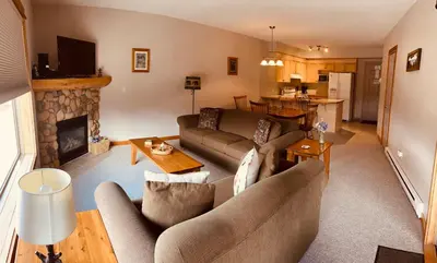 a living room with a couch and a fireplace at Wanna get away in the Rocky Mountains in Canmore