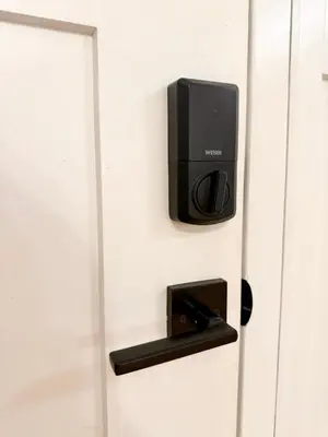 a door with a tv attached to it at Burnaby Metrotown Cozy 3 Bedroom Suite Walk to Skytrain and Malls in Burnaby