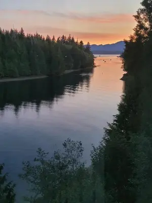 a view of a river at sunset at Argo's Landing in Bamfield