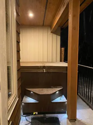 a small sauna with steps leading to a balcony at Cozy Modern Ski-in & Ski-out, Hot Tub, Townhouse in Sun Peaks