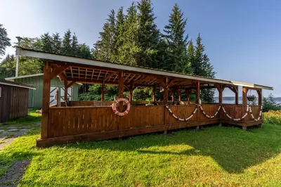 a gazebo with a wreath on it in a yard at The Cabins at Alert Bay in Alert Bay