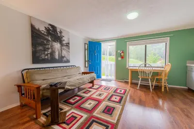 a living room with a couch and a table at The Cabins at Alert Bay in Alert Bay