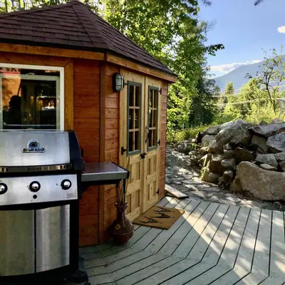 a small cabin with a stove and a grill at Funky Bunky in Nelson