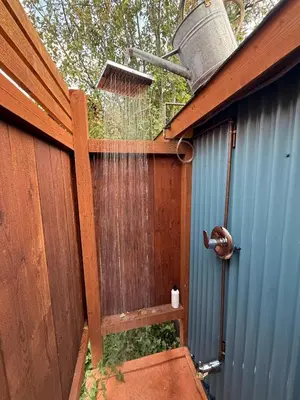 an outside view of a fence with a bird feeder at Funky Bunky in Nelson