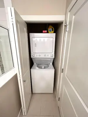 a washer and dryer in a small room at Stay In The Okanagan - Copper Sky, West Kelowna in West Kelowna