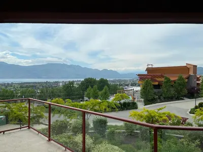 a view of a city from a balcony at Stay In The Okanagan - Copper Sky, West Kelowna in West Kelowna