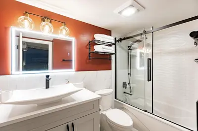 a bathroom with a toilet and a sink and a shower at Vancouver Nest Downtown 2BR near Rogers Arena in Vancouver