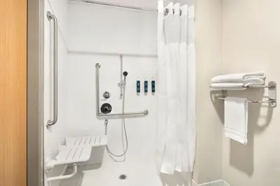 a bathroom with a shower with a shower curtain at Four Points by Sheraton Penticton at the Convention Centre in Penticton