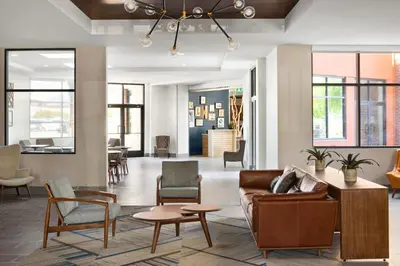 a living room with a couch and chairs at Four Points by Sheraton Penticton at the Convention Centre in Penticton