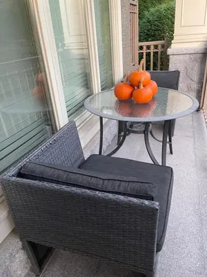 a table with pumpkins on it on a porch at Campus Haven in Vancouver