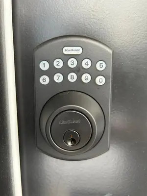 a close up of a remote control on a car door at Victoria private studio suite in Victoria